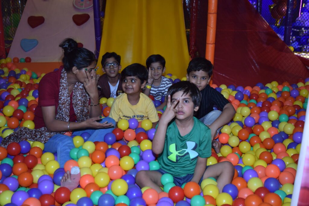 Kids playing in the ball pool at Unplug Kids Jind